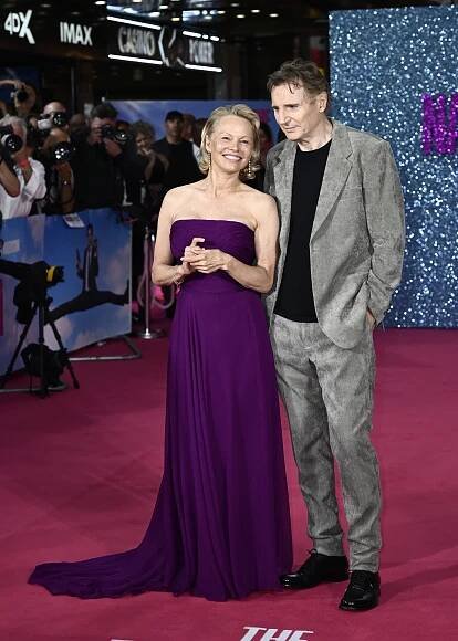 Pamela Anderson and Liam Neeson at "The Naked Gun" London premiere.