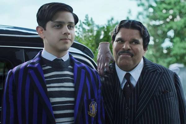 Isaac Ordonez as Pugsley Addams, Thing and Luis Guzmán as Gomez Addams in episode 201 of 'Wednesday.'
