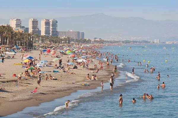 Crowded beach in Torremolinos, Spain.