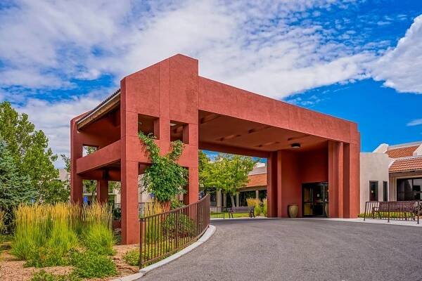 a large red building with a driveway leading to it .