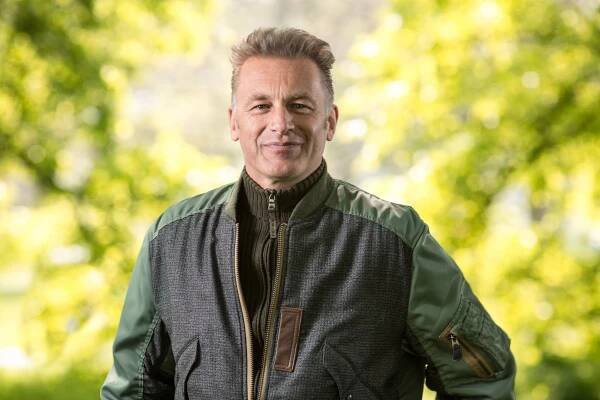 Chris Packham in a green jacket.