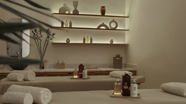 A Room With A Shelf And A Mirror