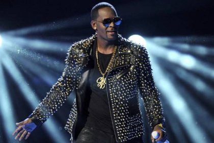 R. Kelly performs at the BET Awards at the Nokia Theatre on Sunday, June 30, 2013, in Los Angeles. The R&B superstar known for his anthem “I Believe I Can Fly,” was convicted Monday in a sex trafficking trial after decades of avoiding criminal responsibility for numerous allegations of misconduct with young women and children. (Photo by Frank Micelotta/Invision/AP)
