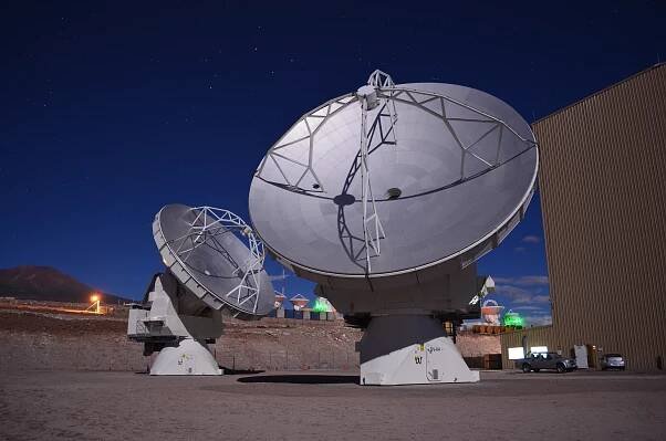 2 NA/Vertex antennas at night.