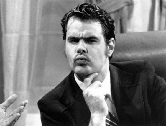 Black and white photo of Dan Aykroyd as President Richard Nixon on Saturday Night Live.