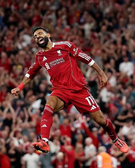 Mohamed Salah of Liverpool celebrating a goal.