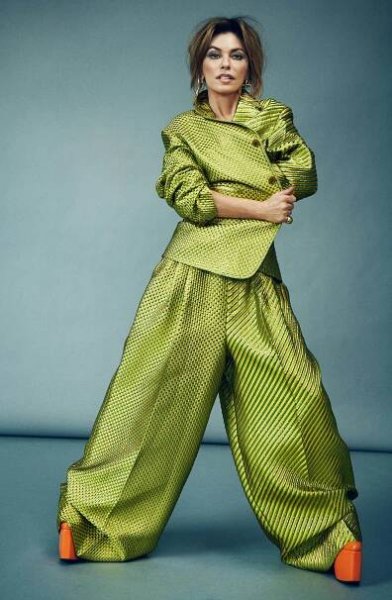 Christopher John Rogers jacket, $1,495 and pants, $1,195 both at Net-a-Porter.com; “Romsey” platforms, $515 at RokerAtelier.com; “LouLou” earrings, $242 at JenniferZeuner.com; “Globe” brass ring, $325 at JenniferFisherJewelry.com