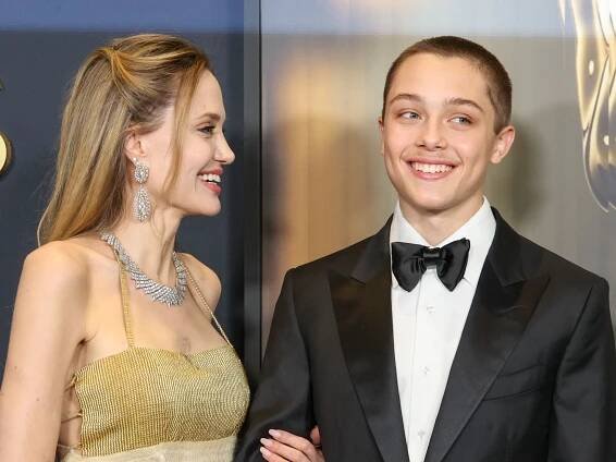 Knox Jolie Pitt looks strikingly like his parents as he buys groceries with a friend