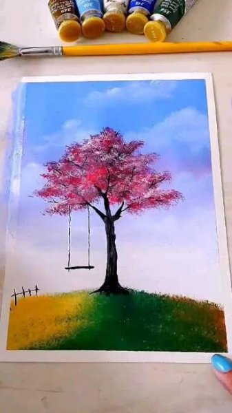 a painting of a tree with a swing in the background and crayons next to it