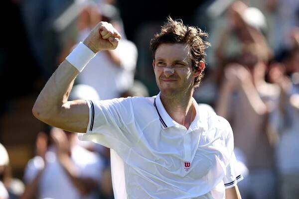 Nicolas Jarry celebrates winning a Wimbledon match.