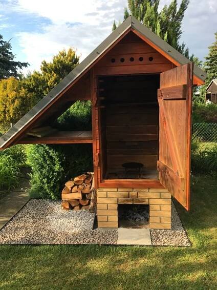 Backyard BBQ with Stacked Wood