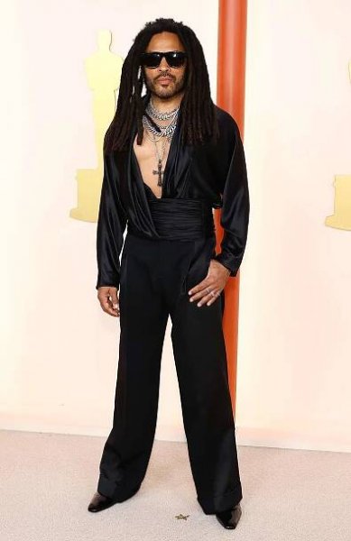 Lenny Kravitz Brings Rocker Style to the Oscars 2023 Red Carpet in Plunging Silk Blouse