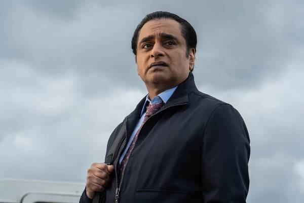 Sanjeev Bhaskar in a dark jacket.