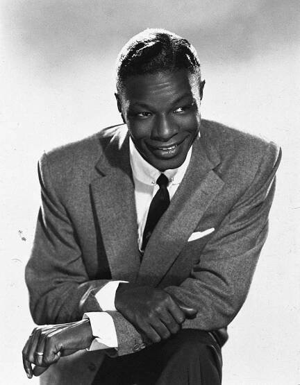 Legendary Singer Nat King Cole in a Pensive Pose Wallpaper