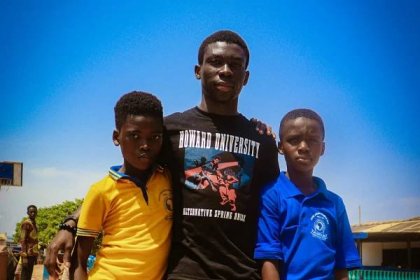 Ghanian native and Howard University Student freshman Isaac Nyadu Adjei poses with two Kwame Nkrumah Memorial School students. 