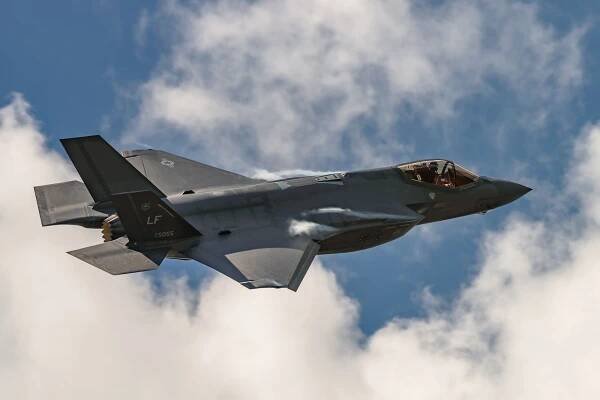 A Lockheed Martin F-35 Lightning II flying in the sky.