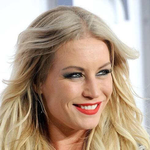 Denise Van Outen shimmies in disco mini dress