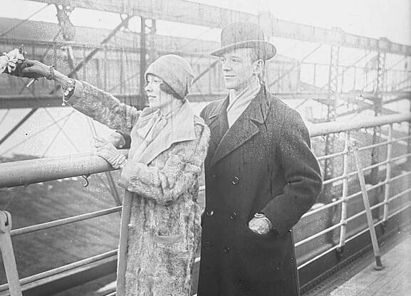 Fred & Adele Astaire standing outside wearing coats and hats - circa 1900