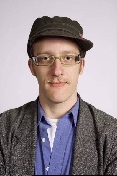 Elegantly Dressed Gent with Glasses and Fedora
