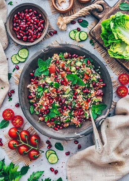 Tabbouleh Salad with bulgur, tomatoes, cucumber, red onion, parsley, mint and pomegranate seeds