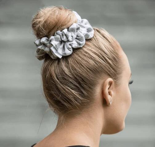 A scrunchie bun is a fun no-braid hairstyle you can try! 