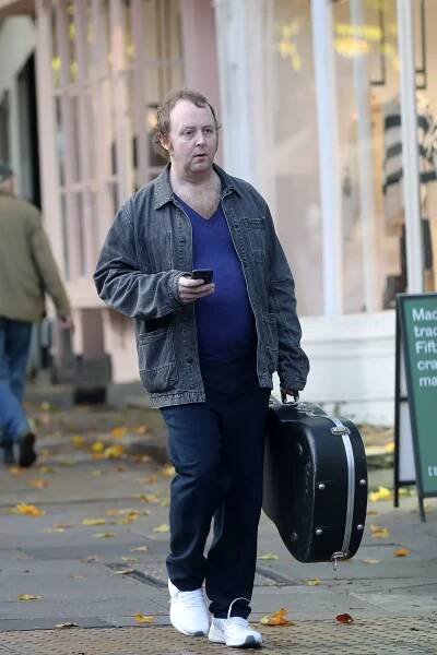 Paul McCartney’s lookalike son James pictured grabbing a coffee with guitar - The Mirror