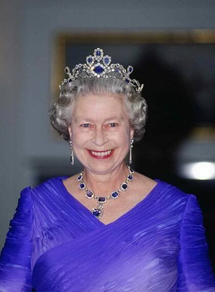 Queen Elizabeth II in The King George VI Victorian Suite Of Sapphire And Diamond Necklace.
