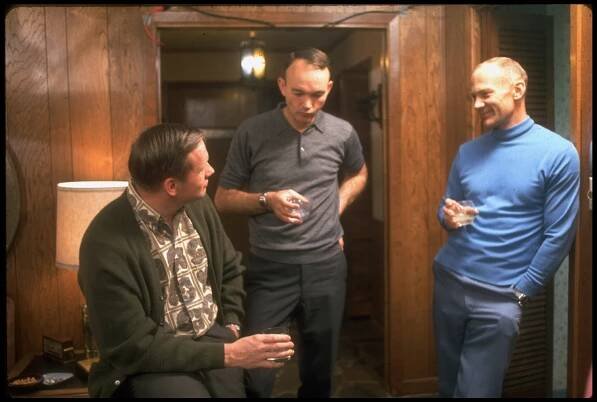 Apollo 11 astronauts Neil Armstrong, Michael Collins and Buzz Aldrin chat over drinks in Houston before their historic flight.