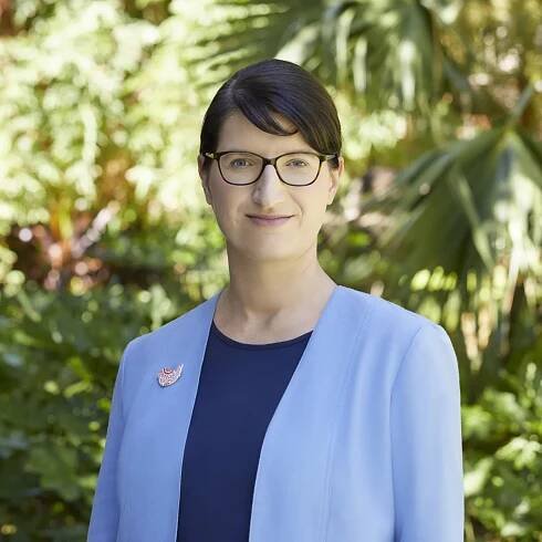 Madlen Jannaschk in blue jacket and navy top with planting background