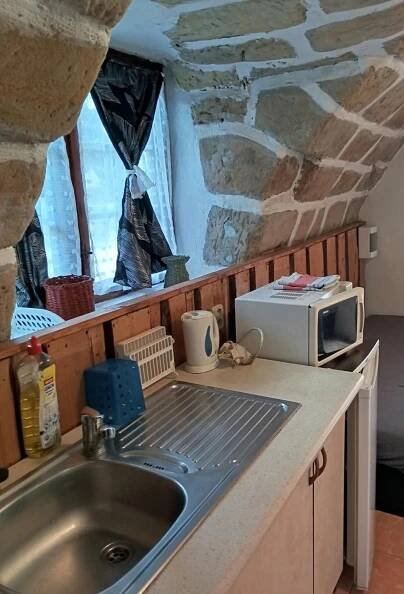 Kuchyň nebo kuchyňský kout v ubytování Apartmán Roubenka na Dobřeni