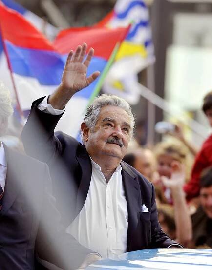 José Mujica waves to the crowd in the streets of Montevideo on the day of his inauguration on March 1, 2010. 