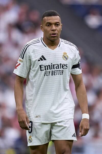 Kylian Mbappé in Real Madrid uniform.