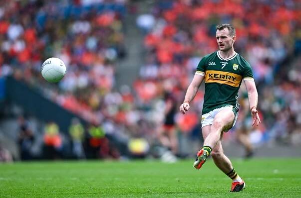 Tom O'Sullivan of Kerry kicking a football.