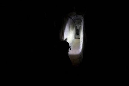 Image of an Israeli soldier secures a tunnel underneath Al Shifa Hospital in Gaza City.