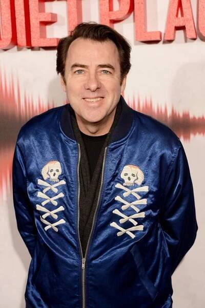Jonathan Ross photographed wearing a shimmery blue jacket with skull and bone motifs down the breast