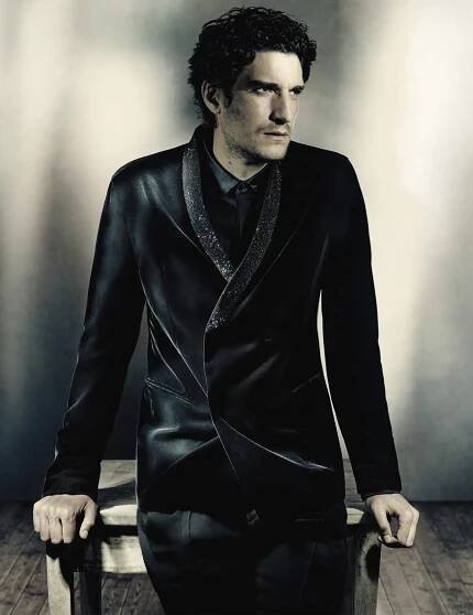 Louis Garrel dons an evening number for Giorgio Armani's fall-winter 2023 campaign.