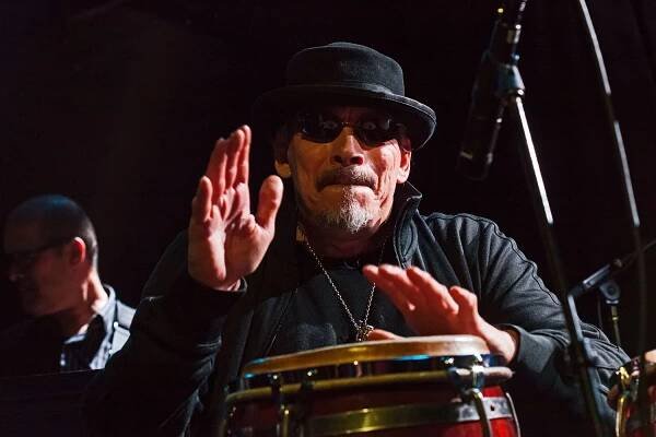 Jerry Gonzalez plays congas and trumpet