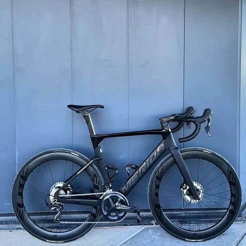A black Merida Reacto 5000 with Marvel 60D and Accessories