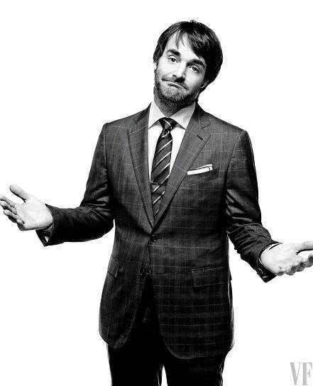 Image may contain Clothing Apparel Suit Coat Overcoat Tie Accessories Accessory Human Person Will Forte and Man