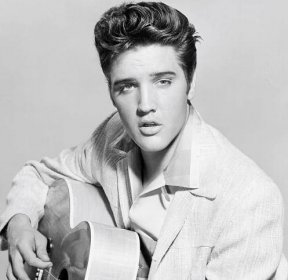 "Suspicious Minds" singer Elvis Presley with a guitar