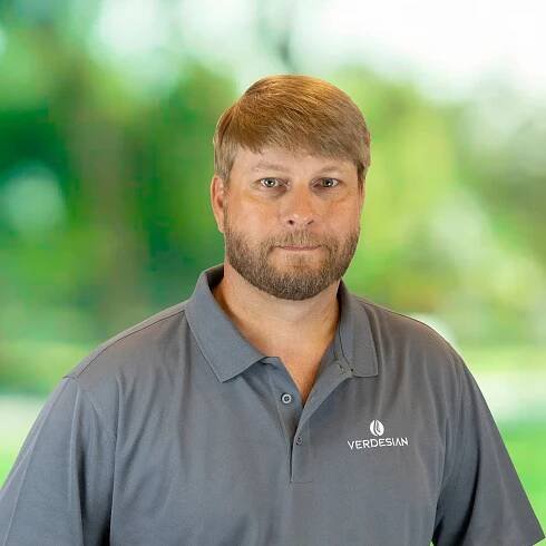Josh Allen, Account Manager, Mississippi, Louisiana & Arkansas at Verdesian, in front of a green blurred background