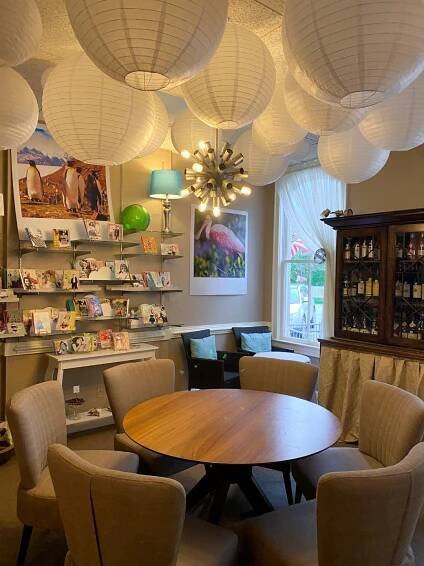 round table with tan fabric chair