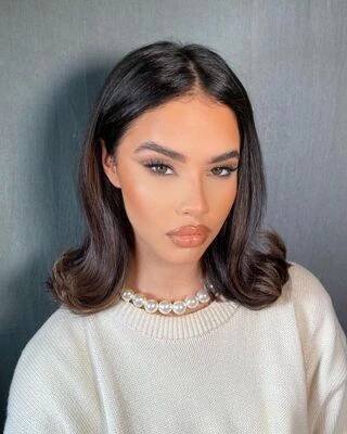 Image may contain Selina Mour Adult Person Hair Head Face Accessories Jewelry Necklace and Black Hair