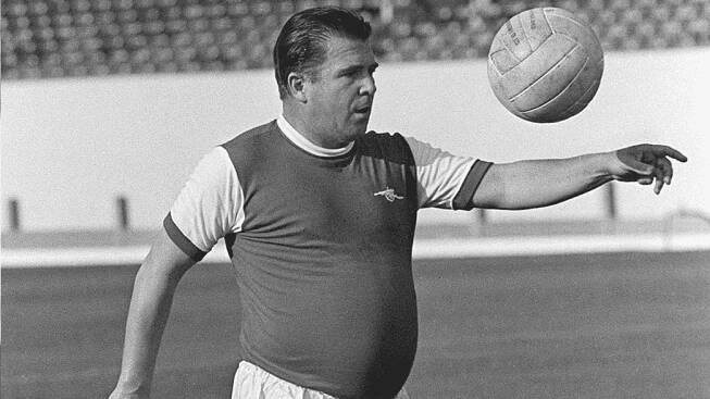 Ferenc Puskas wearing an Arsenal shirt at Highbury in 1971