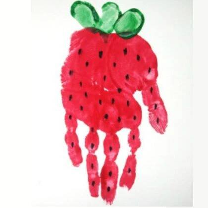 a child's hand made to look like a watermelon