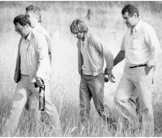 Gary Murphy on a crimescene walkthrough of the Reen paddock with police, 1986.