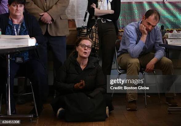 In the packed classroom at Boston Latin School on Feb. 26 French teacher Jessica Blackler speaks from the floor. She is flanked by Christine Kelley,...