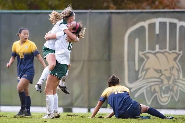  Sydney Leckie (18) and Jenni Santacaterina (12) celebrate after Leckie scored the game winning goal against Kent State in the quarterfinal game of the MAC Tournament on October 28, 2018. The Ohio Bobcats defeated the Kent State flashes 2-1 to advanc