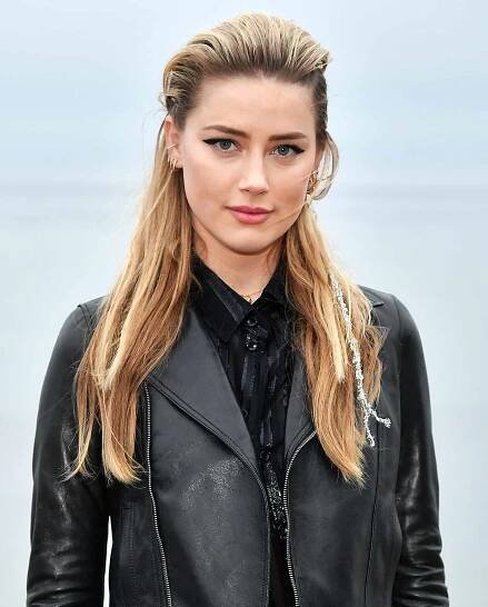 Amber Heard attends the Saint Laurent Mens Spring Summer 20 Show on June 06, 2019 in Paradise Cove Malibu, California