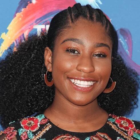 lyric ross wearing low bun hairstyle with cornrows on natural hair